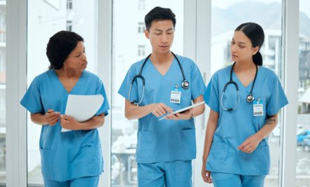 three nurses talking