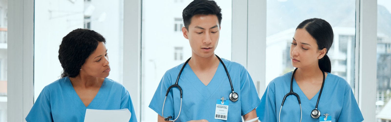 three nurses talking